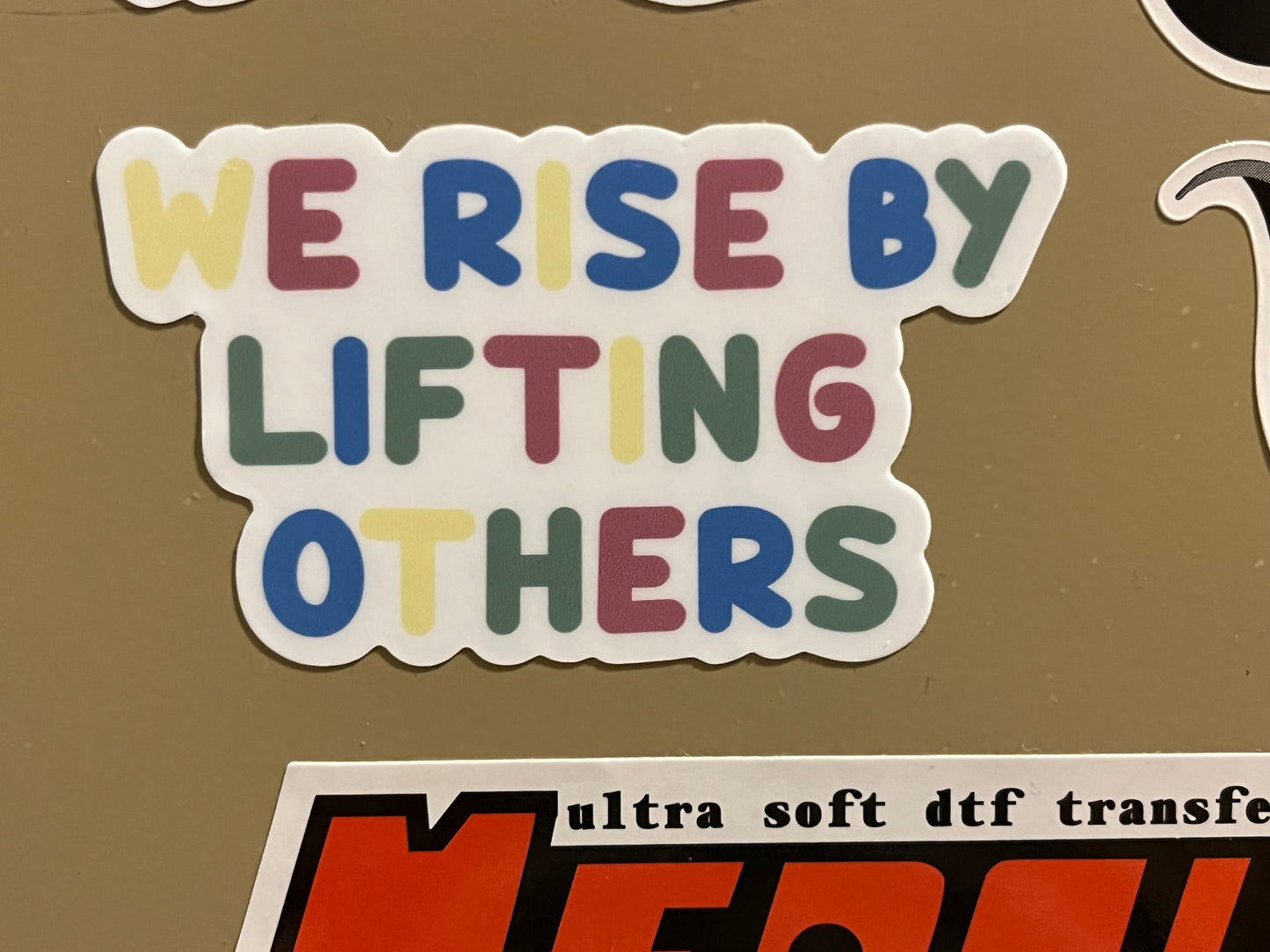 WE RISE sticker