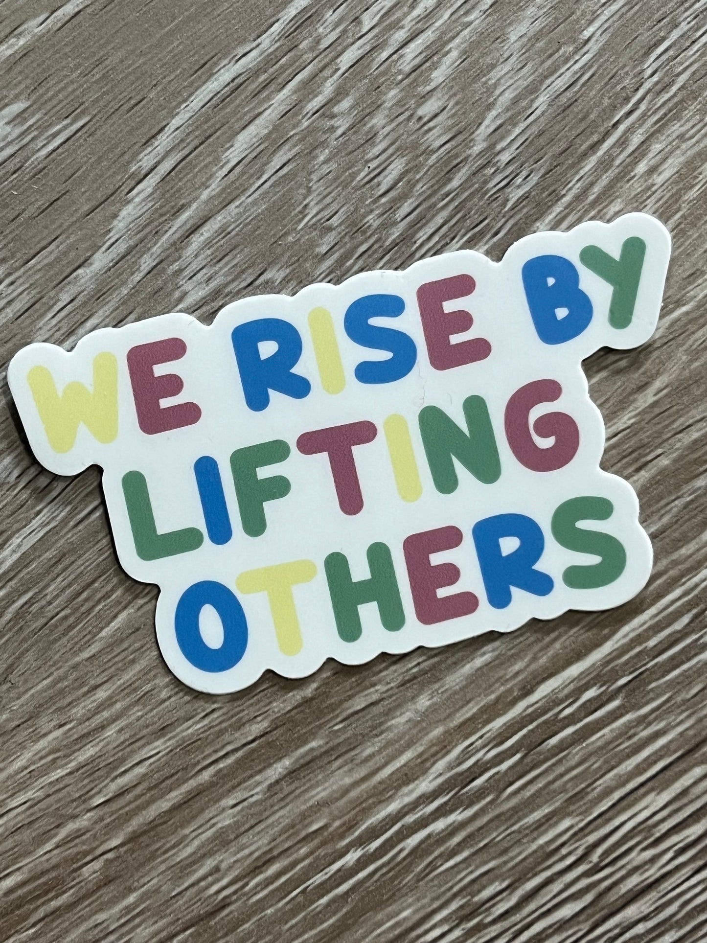 WE RISE sticker